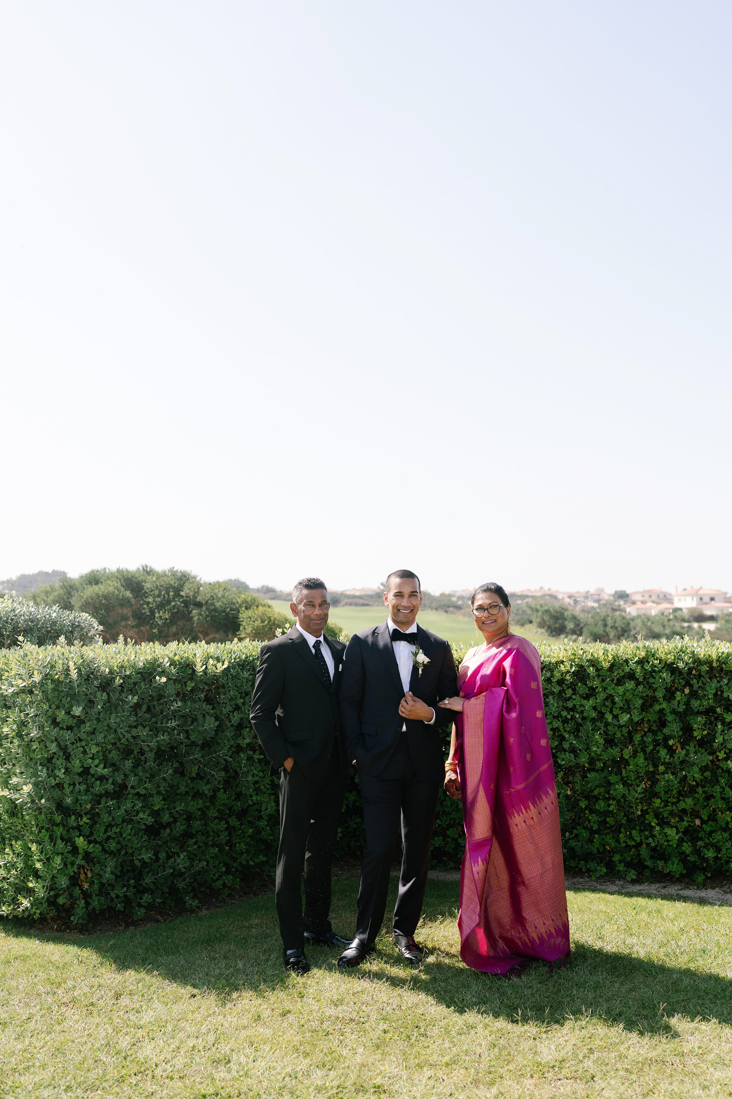 Groom with his parents in the gardens before the wedding, Portugal Groom with his parents in the gardens before the wedding, Portugal