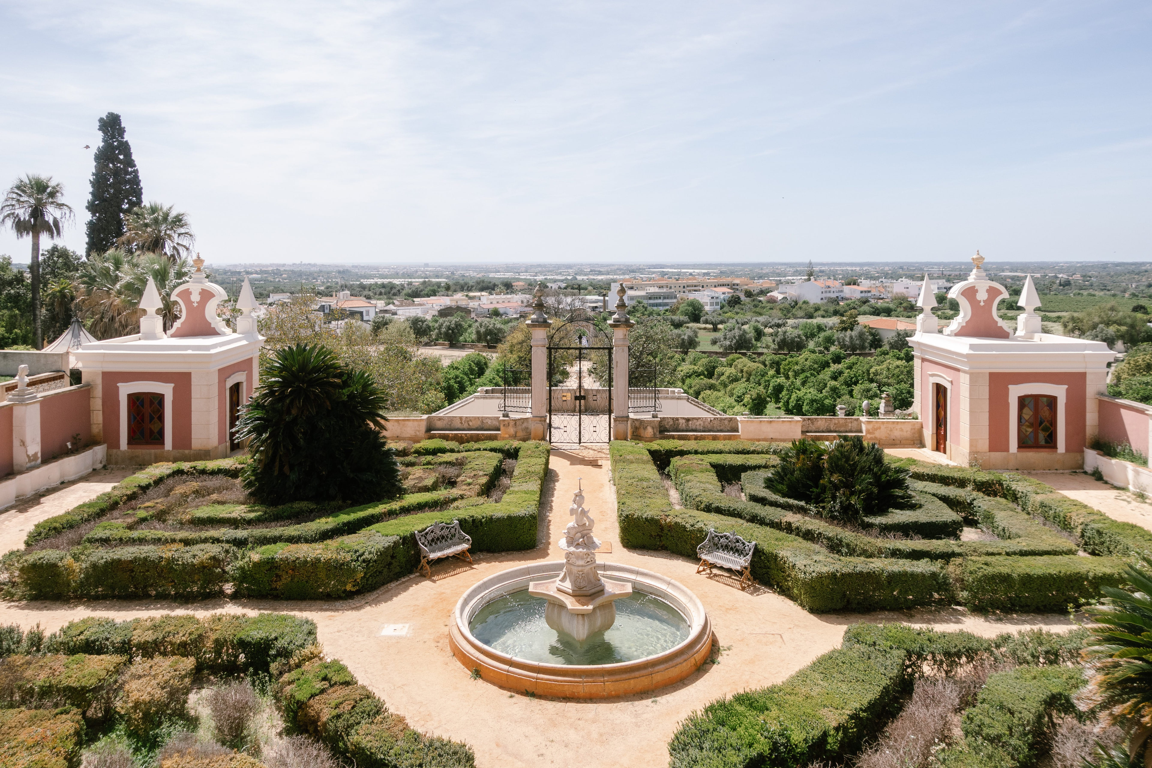 Formal gardens with box hedges and a fountain below the palace of Estoi, Algarve Formal gardens with box hedges and a fountain below the palace of Estoi, Algarve
