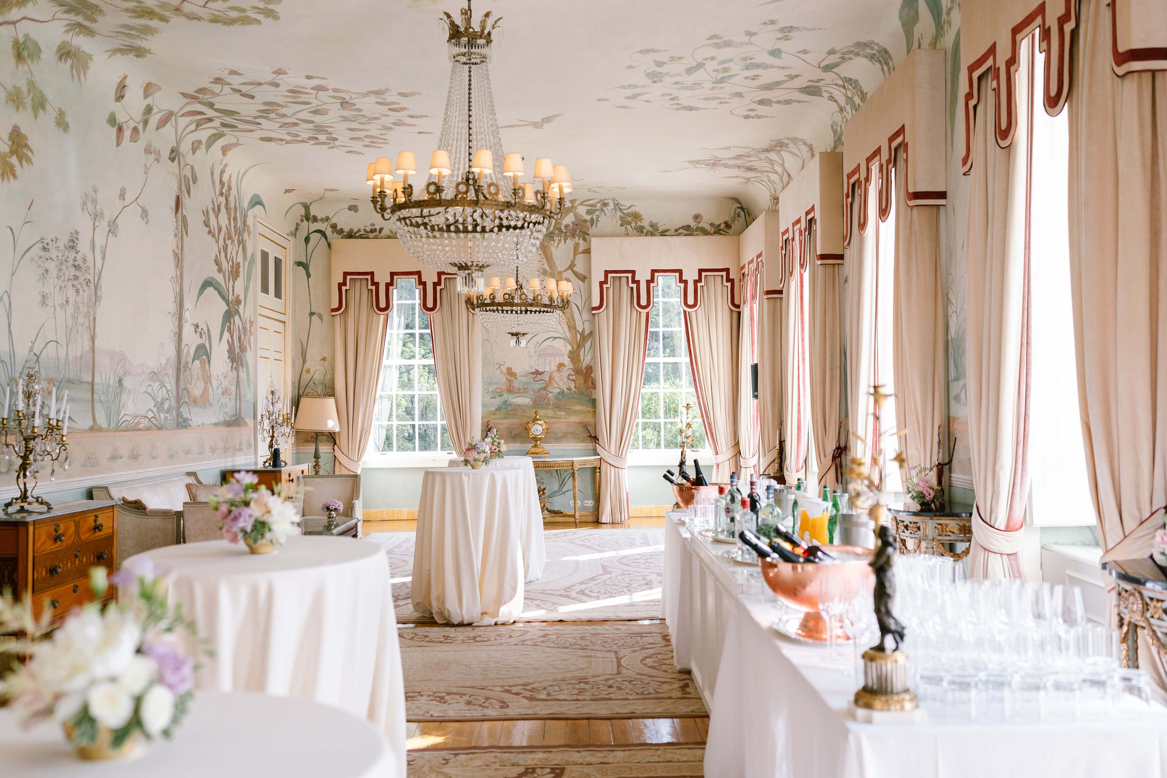 Salon with a chandelier, painted walls and tall windows inside the Seteais Palace, Sintra Salon with a chandelier, painted walls and tall windows inside the Seteais Palace, Sintra