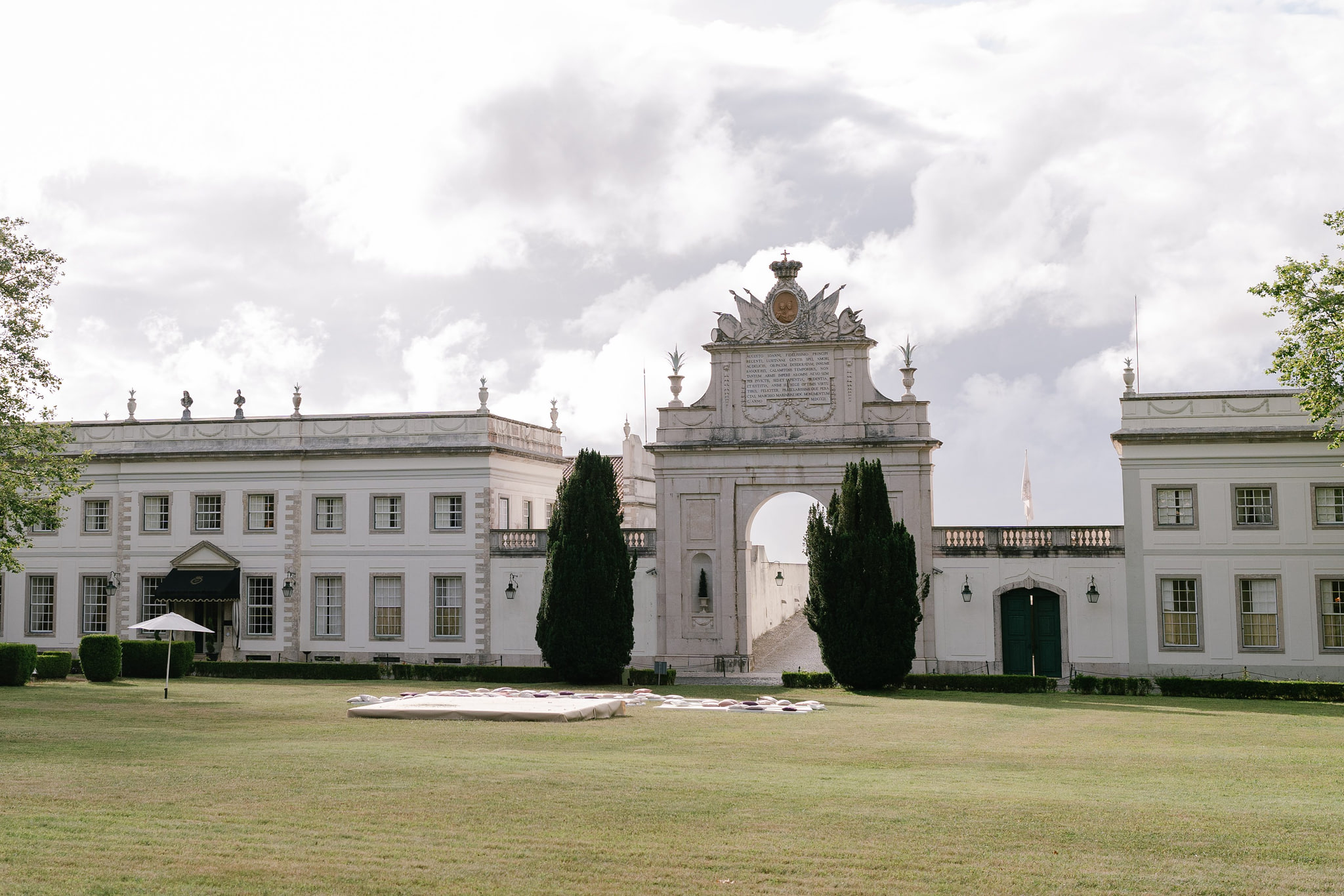 The two white wings of the Seteais Palace joined by its triumphal arch, across the lawn, Sintra The two white wings of the Seteais Palace joined by its triumphal arch, across the lawn, Sintra