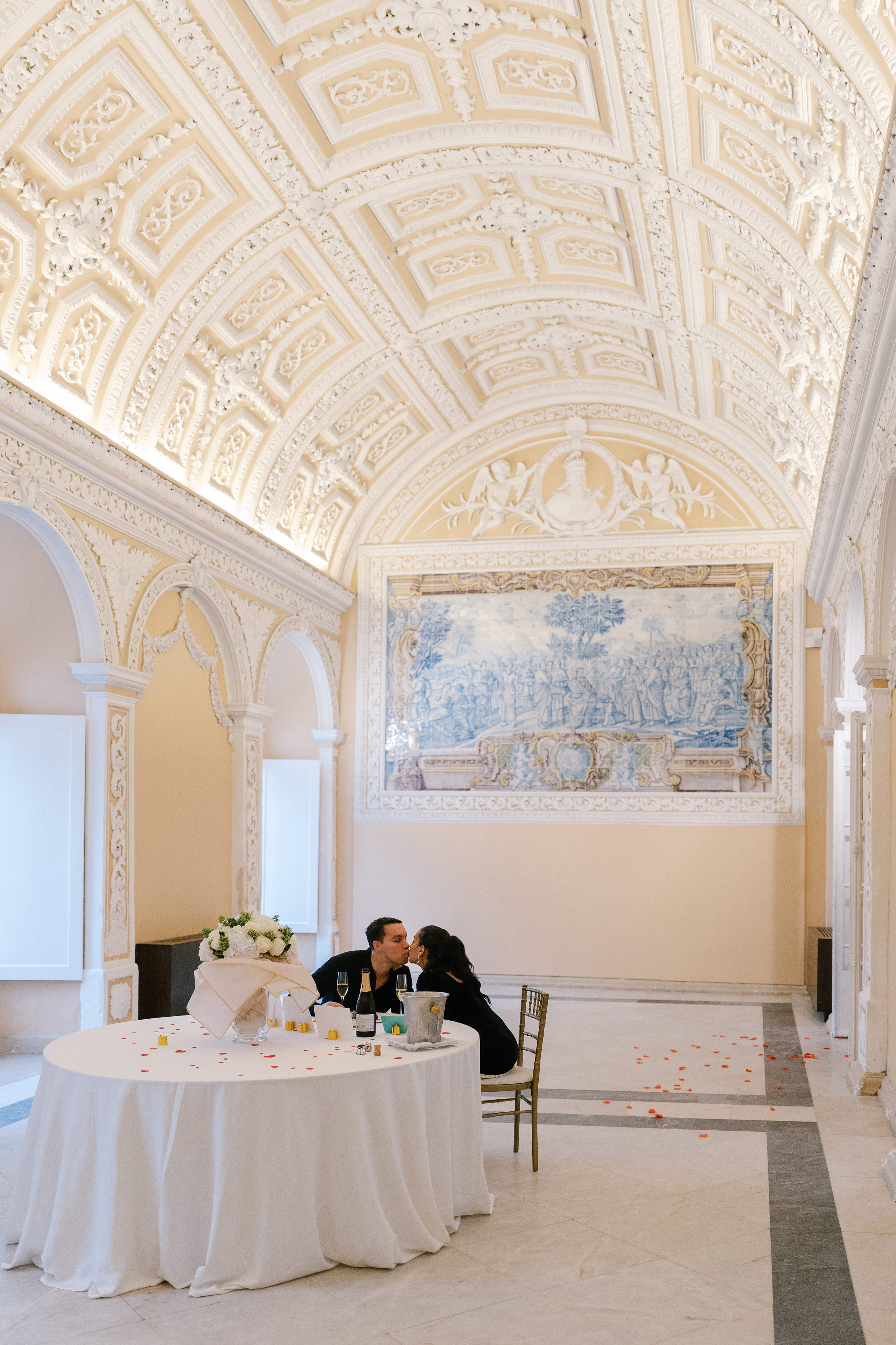A table for two beneath a blue-and-white tile panel and a vaulted ceiling after a proposal at Penha Longa, Sintra A table for two beneath a blue-and-white tile panel and a vaulted ceiling after a proposal at Penha Longa, Sintra