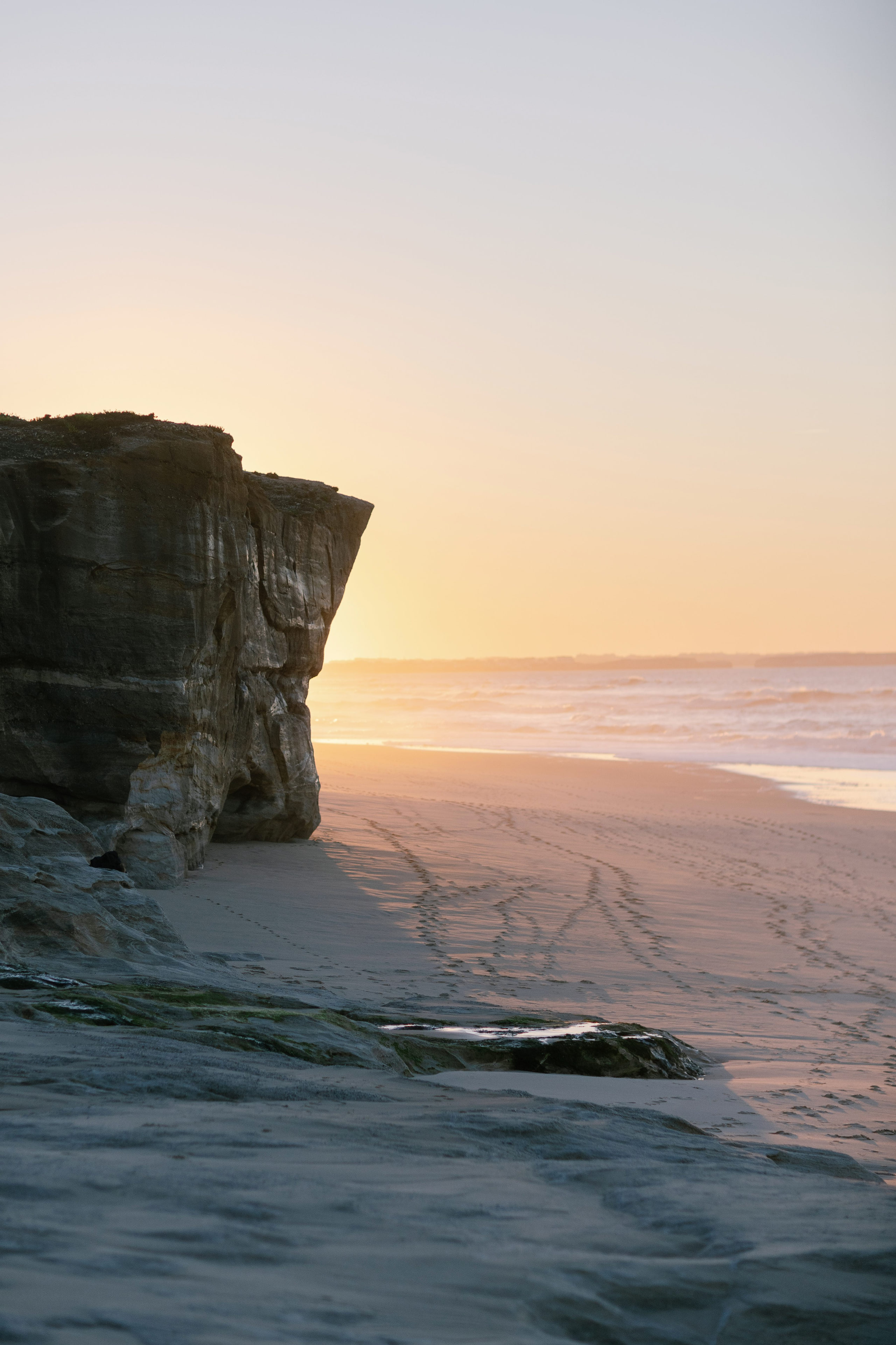 Golden cliffs of Praia D'El Rey glowing at sunset over the Atlantic, Portugal Golden cliffs of Praia D'El Rey glowing at sunset over the Atlantic, Portugal