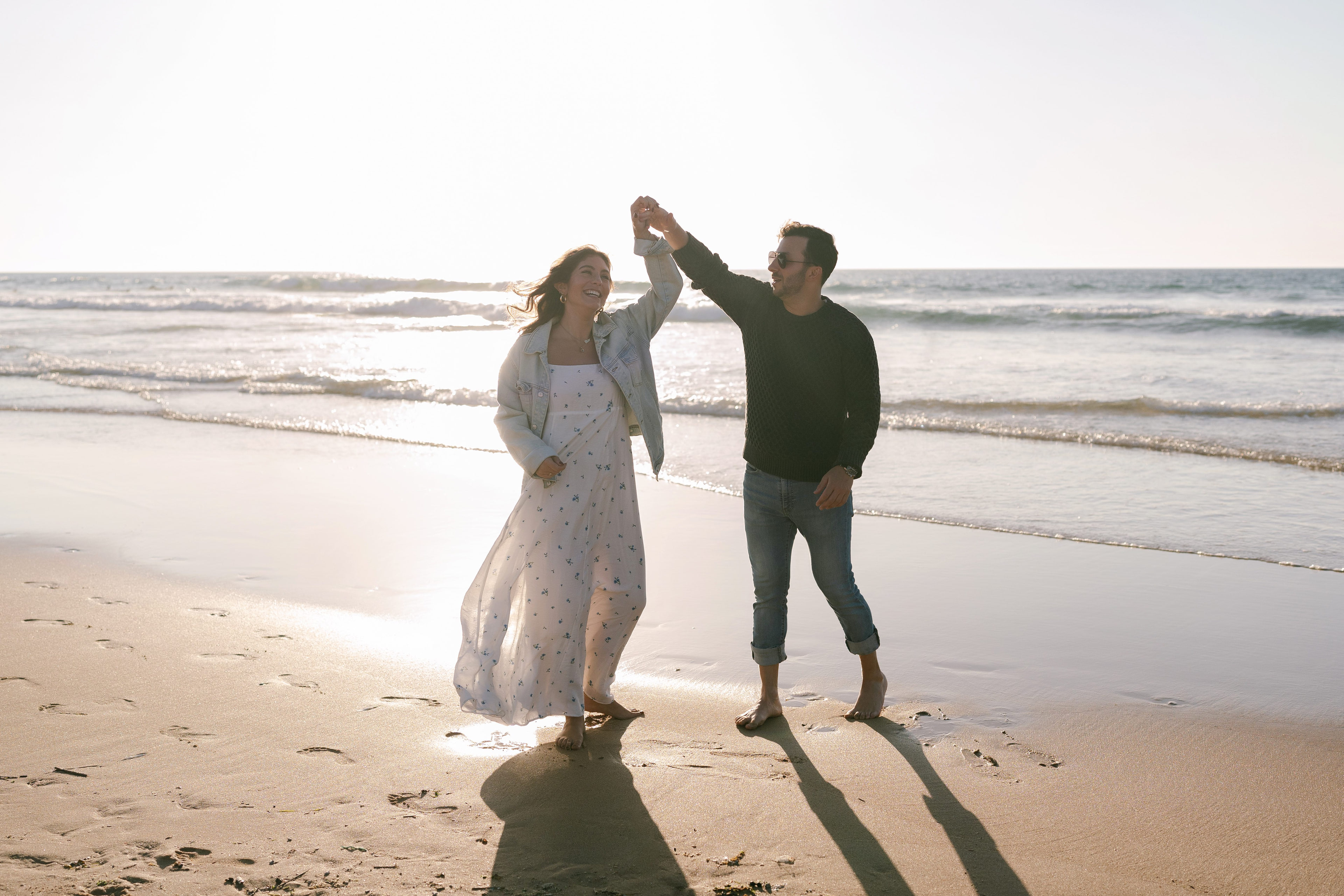 Couple dancing on the beach at Guincho at sunset
